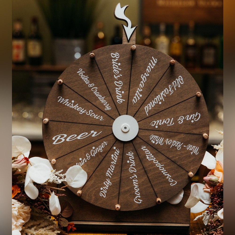 DIYed Drink Wheel for Wedding, featuring various drink options + bride, groom